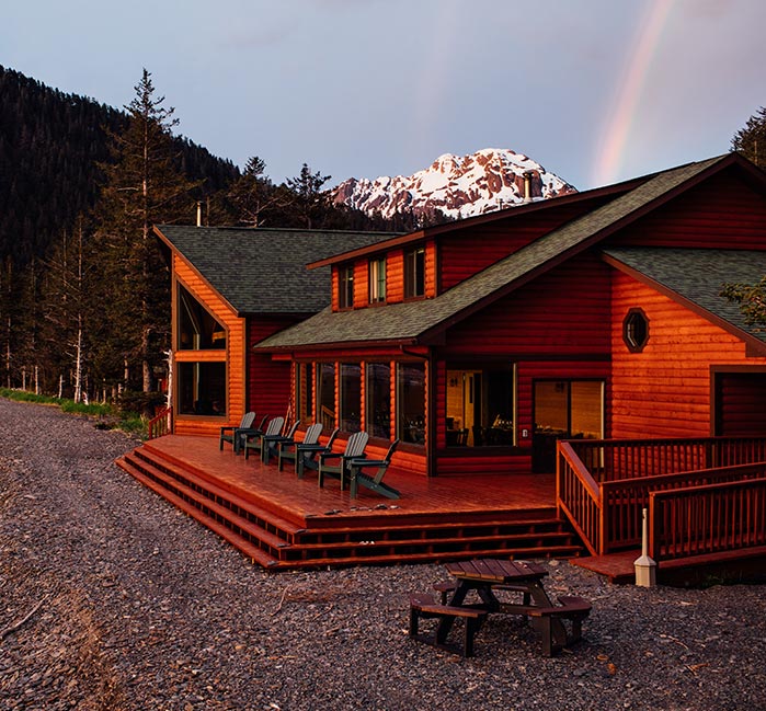 Exterior of guest lodge in golden light.
