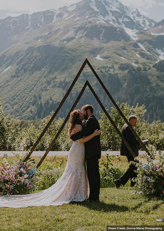 A bride and groom in an outdoor wedding in Seward.