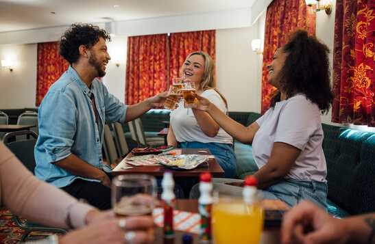 Friends hanging out and toasting with beer