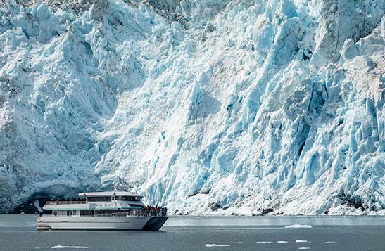 Kenai Fjords Boat with glacier in background