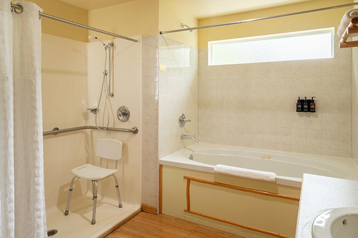 A hotel bathroom with a tub and shower.